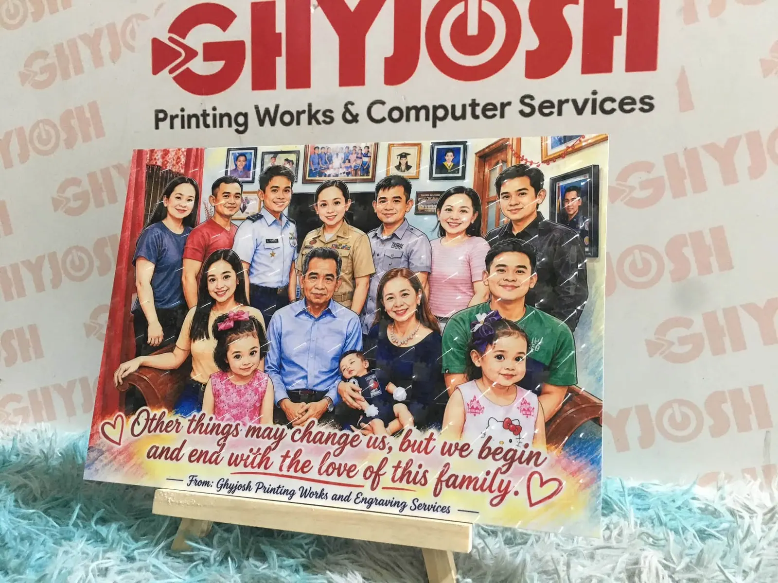 Illustrated family portrait on an easel, with the GhyJosh shop mark on the wall behind it